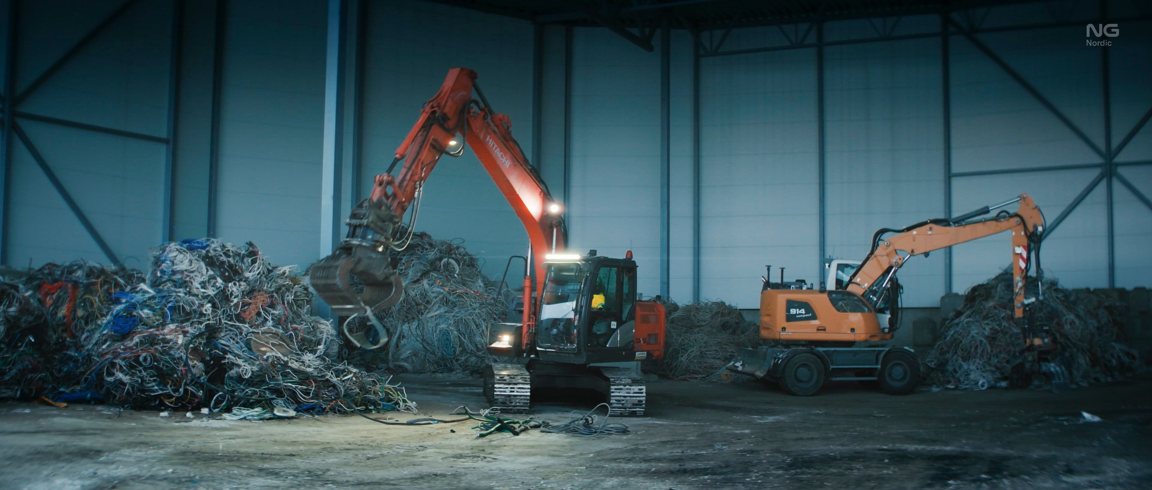 NG Nordic recovery facility interior with excavators handling scrap metal